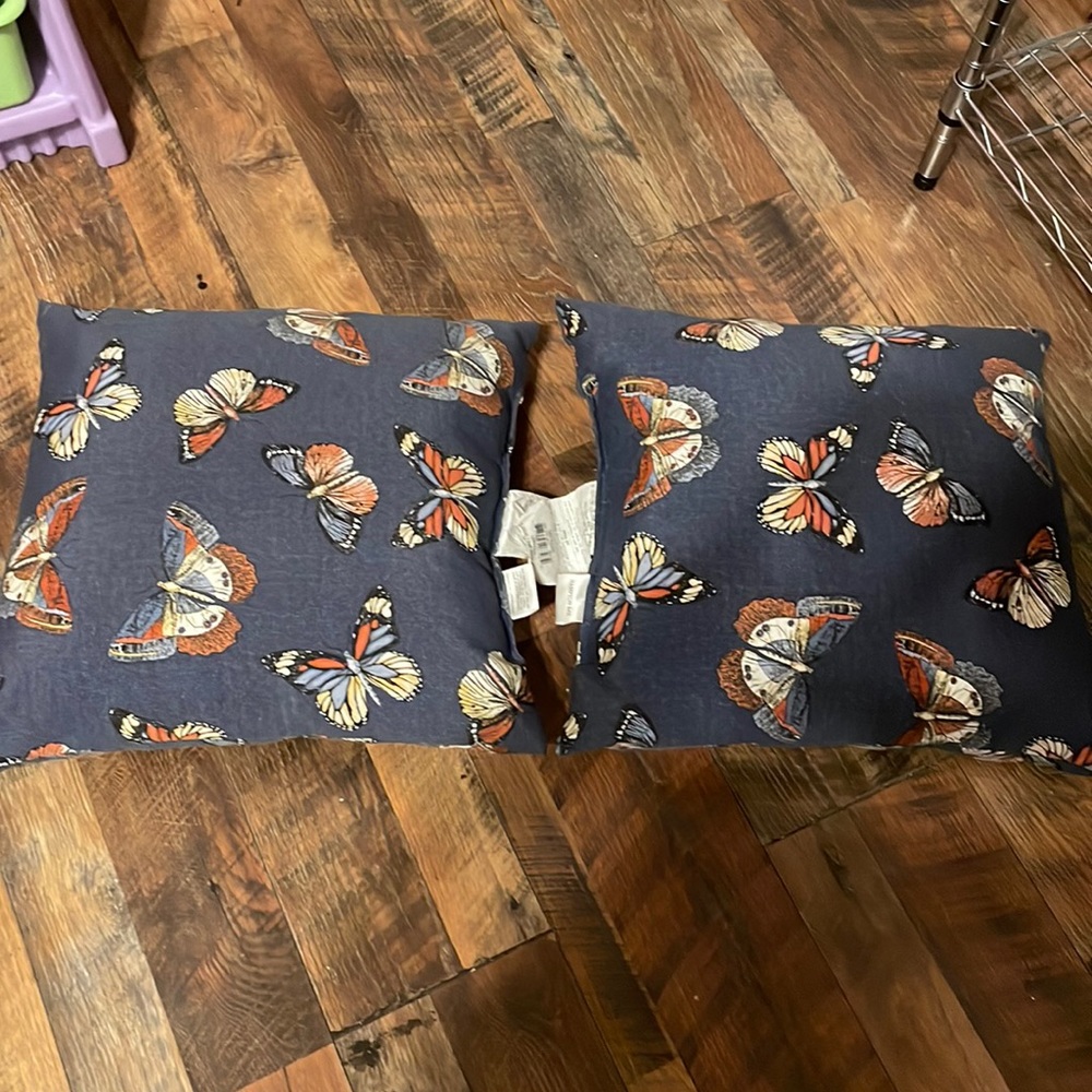 Two outdoor patio chairs pillows.